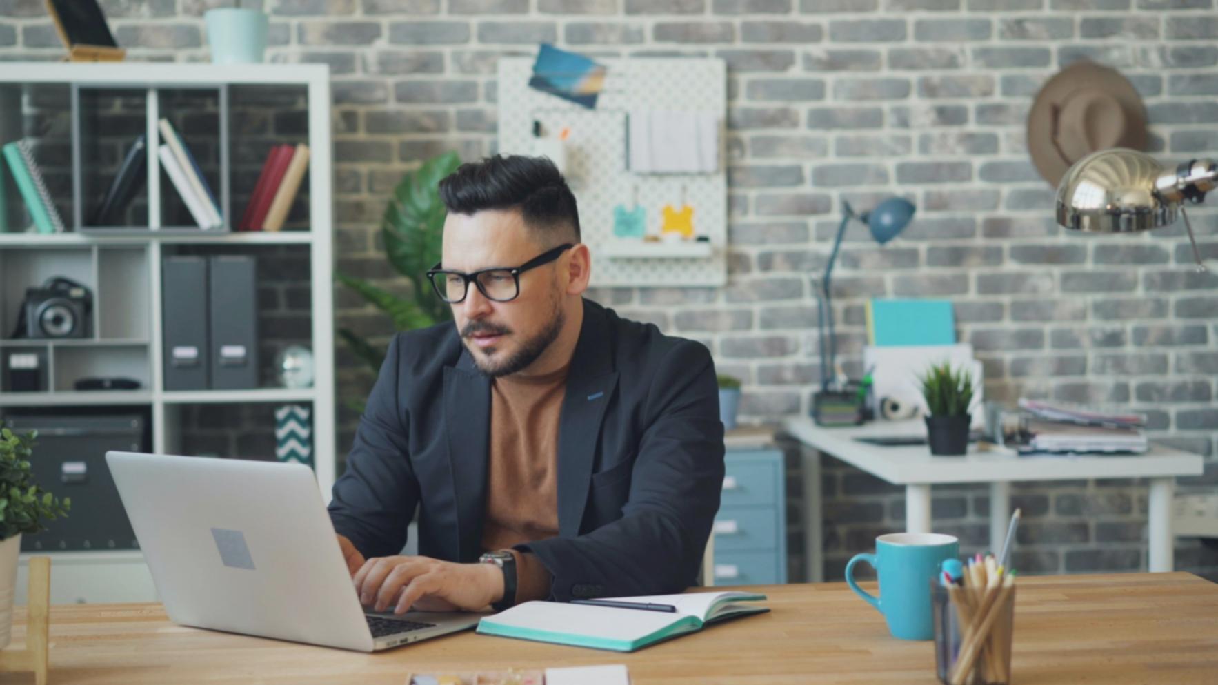 Modern cloud computing setup with multiple monitors displaying ML model performance metrics